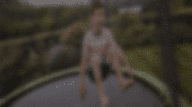 Child bouncing on a trampoline