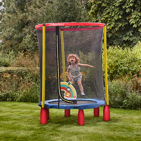 Young girl jumping in an enclosed trampoline